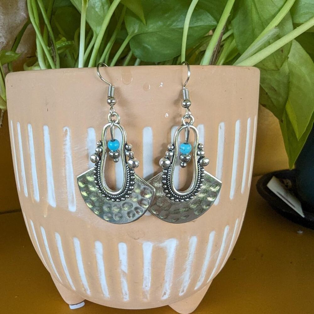 Silver tone dangle earrings